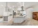 Spacious kitchen with custom cabinets, granite countertops, and an expansive center island at 6612 Saint James Xing, University Park, FL 34201