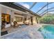 Beautiful lanai with a clear-view screened enclosure, a pool, and ample seating at 6612 Saint James Xing, University Park, FL 34201