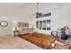 Bright living room featuring tile floors, a large window, and a vaulted ceiling creating an open atmosphere at 6612 Saint James Xing, University Park, FL 34201