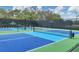 Vibrant pickleball court featuring blue and green surfaces, perfect for recreational play and exercise at 6612 Saint James Xing, University Park, FL 34201