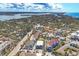 An elevated view of the area, with glimpses of the water, a swimming pool, and neighboring houses at 6790 Sarasea Cir # 6790, Sarasota, FL 34242