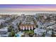 An aerial view reveals the beachfront townhome complex with a pool and lush tropical landscaping near the ocean at 6790 Sarasea Cir # 6790, Sarasota, FL 34242