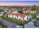 Aerial view highlights the condos, swimming pool, and tropical landscaping of this beachfront community at 6790 Sarasea Cir # 6790, Sarasota, FL 34242
