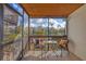 Screened balcony with view, seating and plenty of room for relaxing and enjoying the weather at 6790 Sarasea Cir # 6790, Sarasota, FL 34242