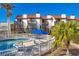 Exterior of condo building with multiple balconies and a community pool at 6790 Sarasea Cir # 6790, Sarasota, FL 34242