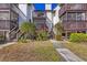 Charming condo complex featuring well-maintained landscaping and private wooden balconies at 6790 Sarasea Cir # 6790, Sarasota, FL 34242