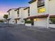 A townhome exterior with garages and tidy landscaping, and a row of individual front entrances at 6790 Sarasea Cir # 6790, Sarasota, FL 34242