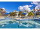 Community pool featuring blue tile trim and comfortable lounge seating for residents to enjoy at 6790 Sarasea Cir # 6790, Sarasota, FL 34242