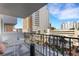 Cozy balcony with chairs overlooking the city's shops and office buildings at 101 S Gulfstream Ave # 7B, Sarasota, FL 34236