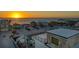 Aerial view of a coastal community showcasing a rooftop deck with stunning sunset and ocean views at 1210 Gulf Blvd, Englewood, FL 34223