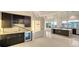 Stylish bar area with dark wood cabinetry, marble countertops, and a built-in wine fridge at 1210 Gulf Blvd, Englewood, FL 34223