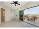Bright bedroom with large sliding glass doors opening to an outdoor balcony at 1210 Gulf Blvd, Englewood, FL 34223