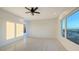 Bright room with sleek marble floors, recessed lighting and a glimpse of the ocean view at 1210 Gulf Blvd, Englewood, FL 34223