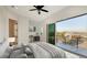 Bright main bedroom with work space and sliding glass doors to the outdoor balcony at 1210 Gulf Blvd, Englewood, FL 34223