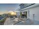 Stylish outdoor seating area on a rooftop deck with modern furniture, offering a perfect spot for relaxation and ocean views at 1210 Gulf Blvd, Englewood, FL 34223