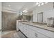 Primary bathroom with double sink vanity, granite countertop, and separate shower and toilet at 2081 Gardenia Ave, Port Charlotte, FL 33953