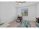 Cozy bedroom with neutral walls, tile floors, and a window offering natural light at 2081 Gardenia Ave, Port Charlotte, FL 33953
