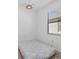 Small bedroom featuring tile floors, a ceiling light and natural light from the window at 2081 Gardenia Ave, Port Charlotte, FL 33953
