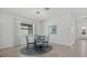Bright dining area features pendant lighting, large window, and seating for four at 2081 Gardenia Ave, Port Charlotte, FL 33953