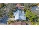 Birds eye view of the home, with an oval circle around the perimeter of the property and landscaping at 2377 Burton Ln, Sarasota, FL 34239