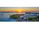 Spectacular aerial view of the city waterfront at sunset with boats, bridges, and stunning city lights at 2377 Burton Ln, Sarasota, FL 34239
