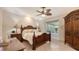 Well-lit bedroom with a decorative wooden bed frame and a large closet at 2377 Burton Ln, Sarasota, FL 34239