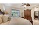 Comfortable bedroom featuring wooden furniture and window with natural light at 2377 Burton Ln, Sarasota, FL 34239
