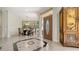 Welcoming foyer with decorative tile flooring, stylish furniture, and a glimpse into the dining area at 2377 Burton Ln, Sarasota, FL 34239