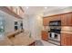 Kitchen with granite counters, stainless appliances, and pendant lighting, adjacent to additional living space at 2377 Burton Ln, Sarasota, FL 34239