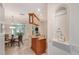 Bright kitchen with an island, granite countertops, hanging cabinets, and a decorative mermaid statue in an alcove at 2377 Burton Ln, Sarasota, FL 34239