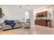 Bright room features a cozy sitting area, a built-in kitchenette, and tile flooring at 2377 Burton Ln, Sarasota, FL 34239
