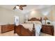 Bright bedroom with dark wooden furniture and tile flooring at 2377 Burton Ln, Sarasota, FL 34239