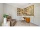 Bright office with a painting, comfortable leather chair, and white desk at 2377 Burton Ln, Sarasota, FL 34239