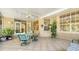 Covered patio boasts tile flooring, ceiling fan, and direct home access through French doors at 2377 Burton Ln, Sarasota, FL 34239