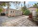 Cozy backyard featuring a mix of concrete pavers, stone and mature landscaping at 2524 11Th W Ave, Bradenton, FL 34205