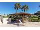 Charming gazebo with seating area, perfect for outdoor relaxation and entertaining near the pool at 3278 Village Green Dr # 1024, Sarasota, FL 34239