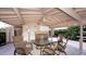 Cozy outdoor patio with comfortable seating, perfect for enjoying meals and gatherings in the shade at 3278 Village Green Dr # 1024, Sarasota, FL 34239