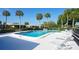 Inviting pool area with comfortable lounge chairs, perfect for soaking up the sun and unwinding at 3278 Village Green Dr # 1024, Sarasota, FL 34239