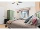 Comfortable bedroom with twin beds, ceiling fan, and wood flooring at 3300 Loveland Blvd # 3203, Punta Gorda, FL 33980