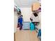 Walk-in closet featuring shelving, hanging racks, and a three-drawer dresser for ample storage space at 3300 Loveland Blvd # 3203, Punta Gorda, FL 33980