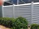 Horizontal slat fence provides privacy and defines the backyard landscape at 3300 Loveland Blvd # 3203, Punta Gorda, FL 33980