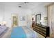 Bright bedroom with ensuite access, comfortable bed, and plenty of storage at 3370 E Chelmsford Ct # 49, Sarasota, FL 34235