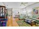 Spacious living room with hardwood floors and comfortable sofas, seamlessly flowing into the dining area at 3370 E Chelmsford Ct # 49, Sarasota, FL 34235