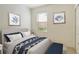 Comfortable bedroom features natural light, decorative wall art, and neutral décor to create a relaxing ambiance at 3823 Parkridge Cir # 1-101, Sarasota, FL 34243