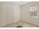 Bright bedroom with neutral carpet, closet, and ample natural light at 3823 Parkridge Cir # 1-101, Sarasota, FL 34243