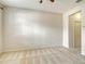 Neutral bedroom with carpet, ceiling fan, and a doorway leading to a closet or bathroom at 3823 Parkridge Cir # 1-101, Sarasota, FL 34243