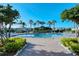 Resort-style community pool with lounge chairs and lush tropical landscaping at 3823 Parkridge Cir # 1-101, Sarasota, FL 34243