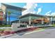 Attractive entrance to the mall at University Town Center with sleek modern design and lush landscaping at 3823 Parkridge Cir # 1-101, Sarasota, FL 34243