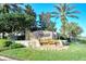 Parkridge Condominiums entrance sign featuring lush landscaping and a calming waterfall feature at 3823 Parkridge Cir # 1-101, Sarasota, FL 34243