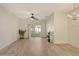 Spacious living room with lots of natural light, ceiling fan, and a sliding door to the outside at 3823 Parkridge Cir # 1-101, Sarasota, FL 34243